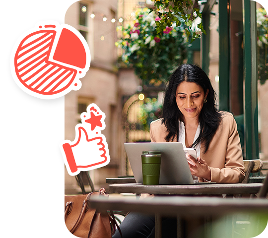 Woman smiling while using a laptop