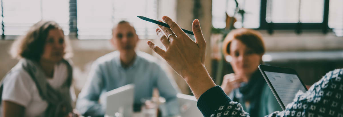 NFP Grants And Funding Header person speaking to a group/committee